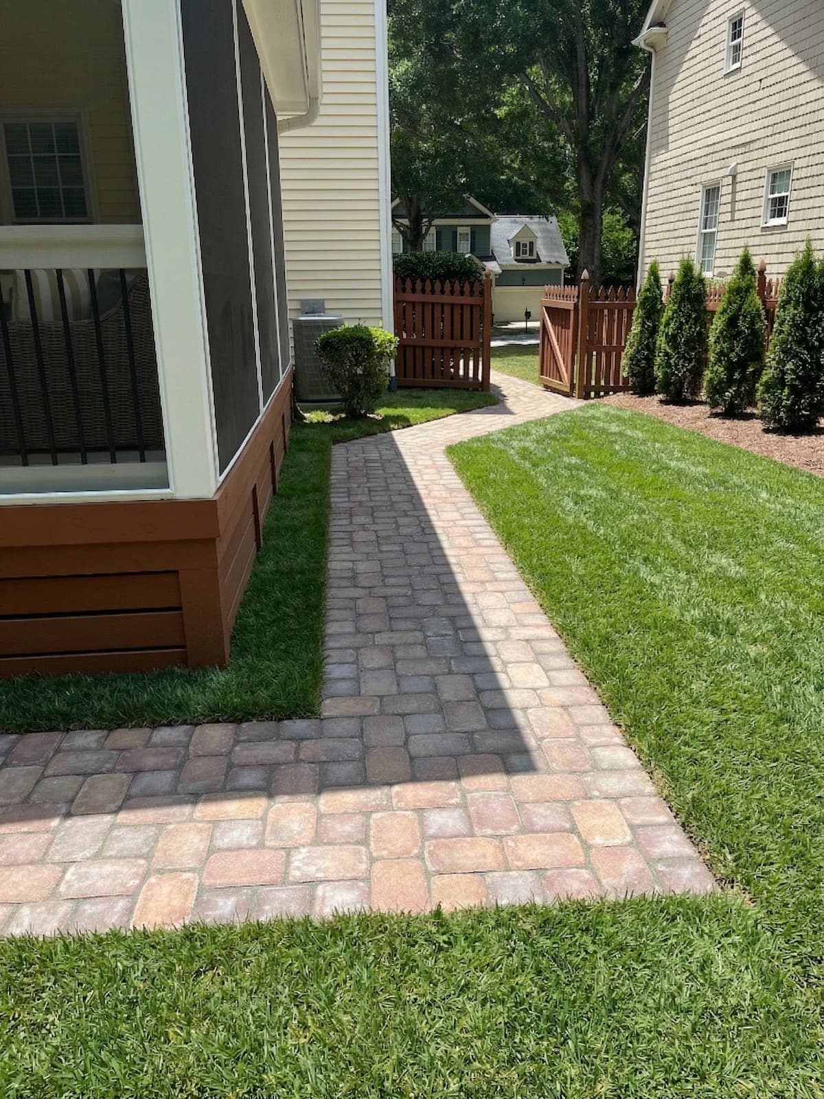 Paver surface with defined joint lines running the length of a home